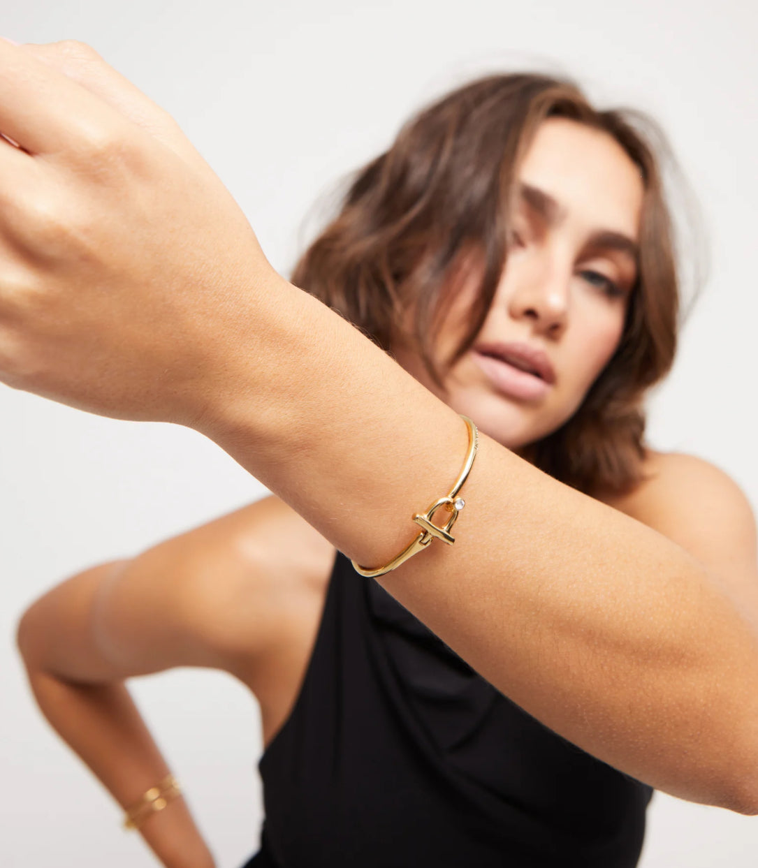 Uno de 50 Gold Bangle Bracelet with white topaz