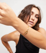 Uno de 50 Gold Bangle Bracelet with white topaz
