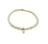 Erin Gray RICE PEARL WATERPROOF BRACELET WITH A GOLD-FILLED LUXE CROSS